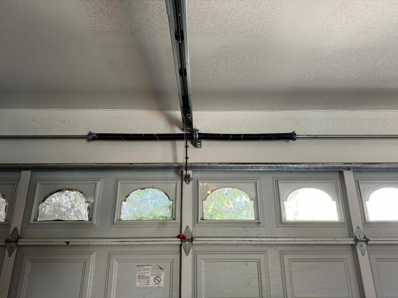A modern two car garage door serviced at a family home in Eastvale, California